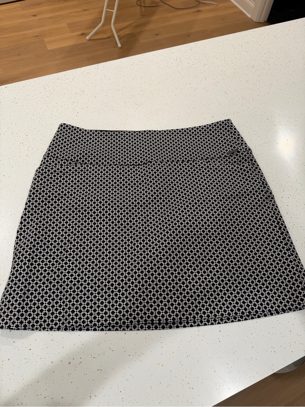 Black and white mini skirt with “shorts” underneath.